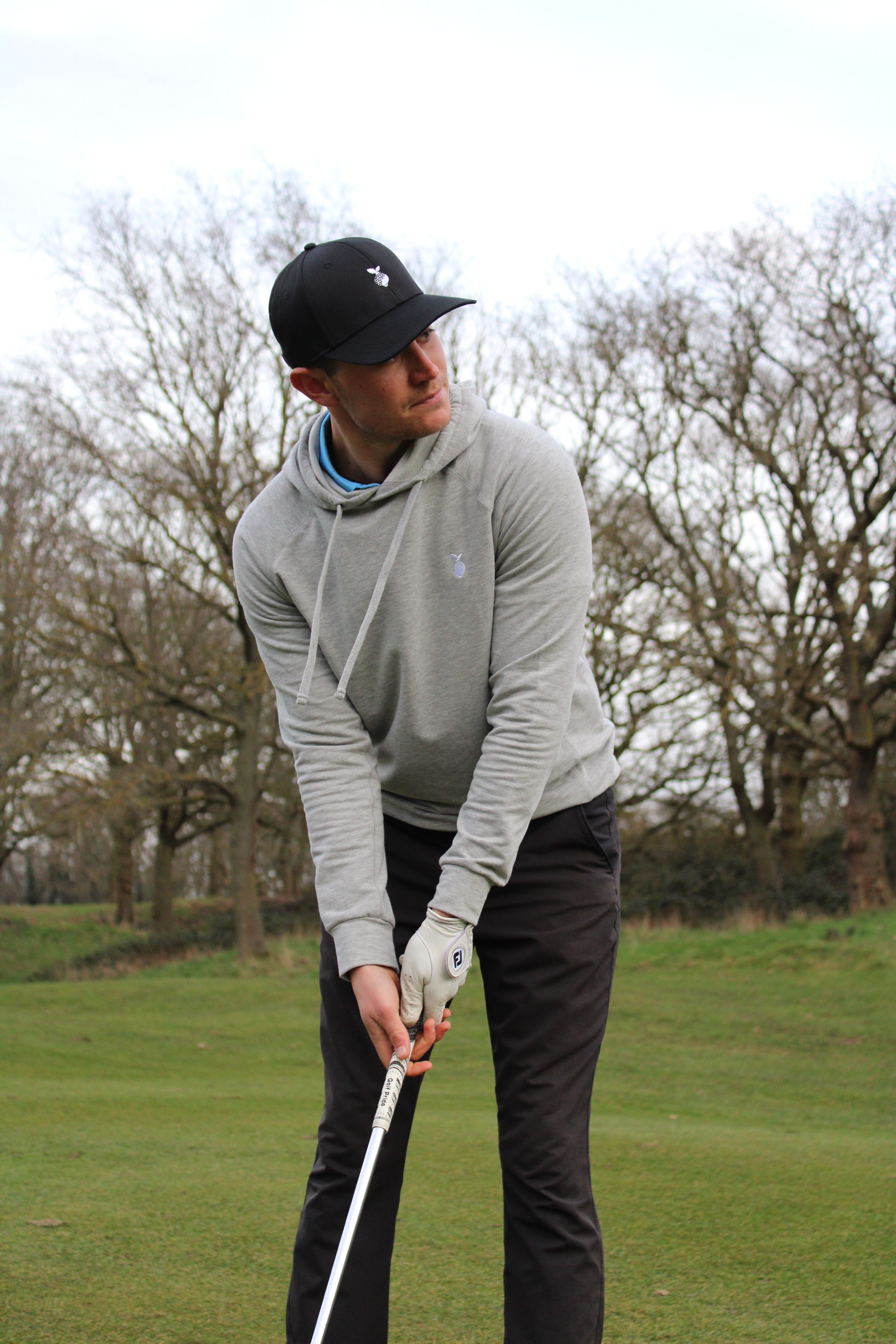 Men's golf clothing on the course